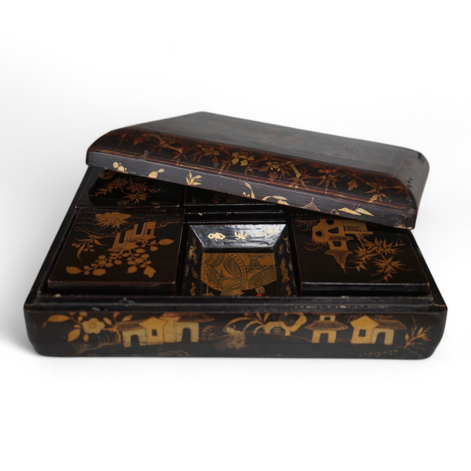 A mid 19th century Chinese gilt decorated black lacquer games box, 31cm wide. Condition - fair to good